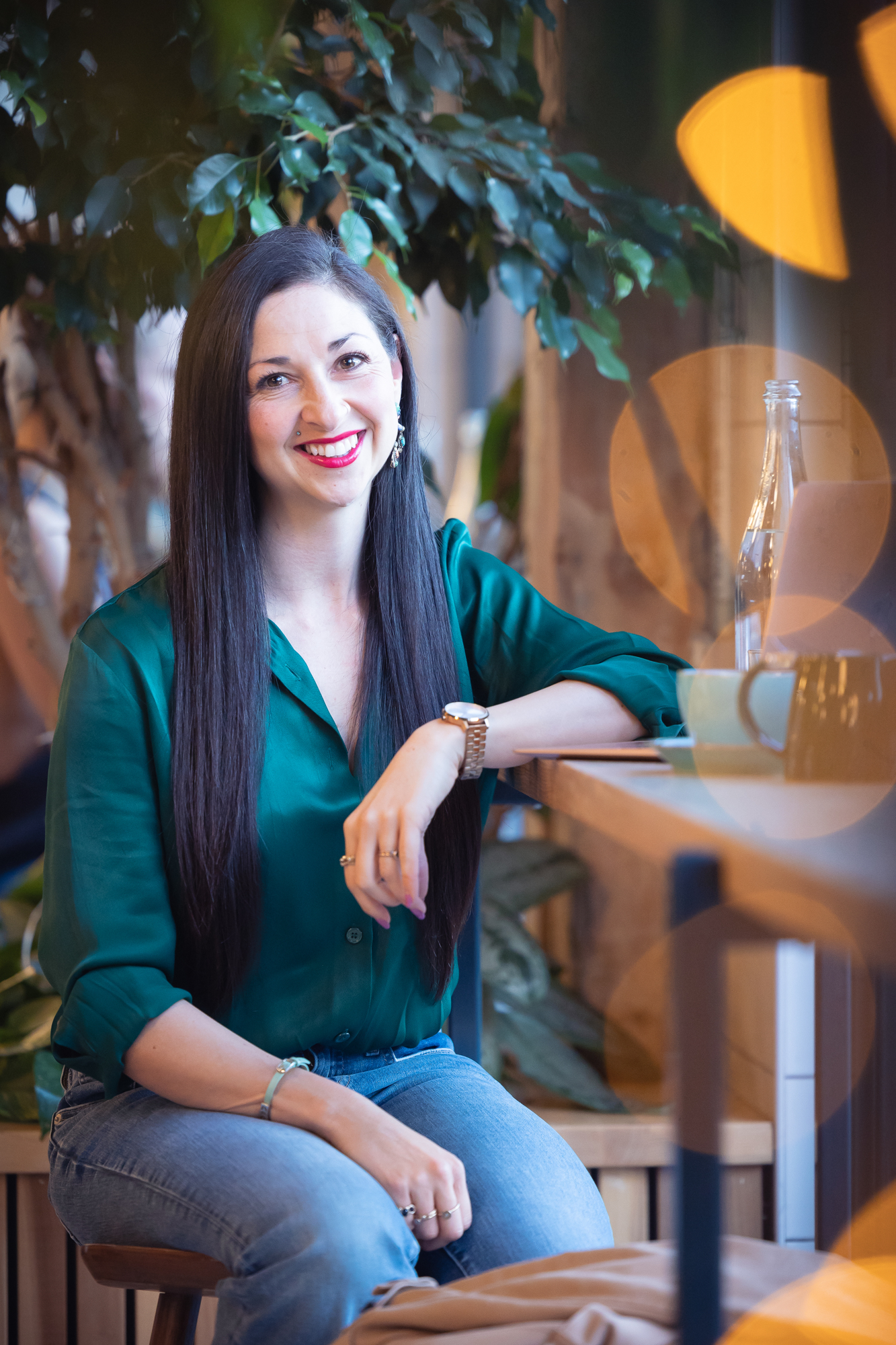Amy smiling, sitting at a counter